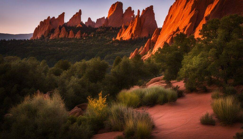 A photo of diverse people at Garden of the Gods at sunrise.
