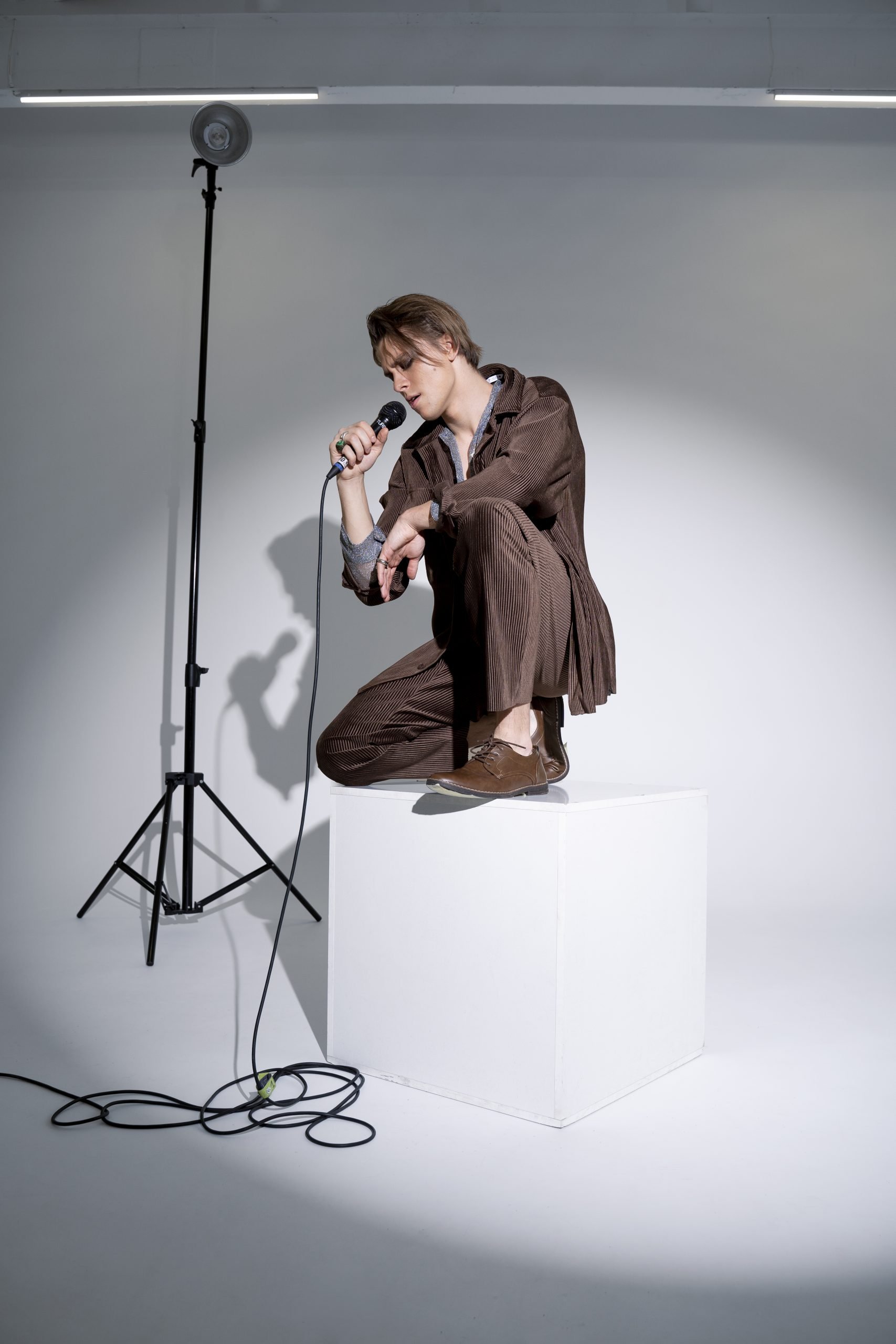 full shot artist performing scaled