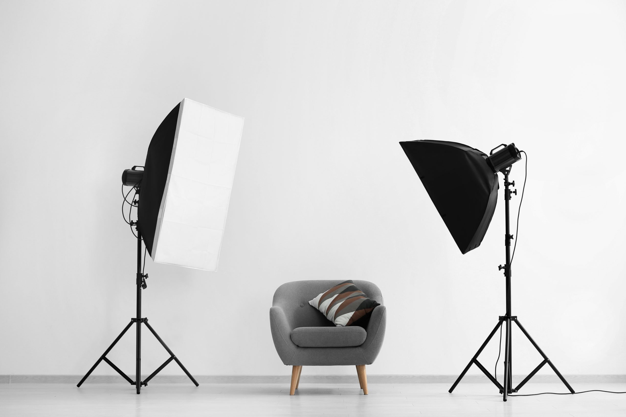 interior modern photo studio with armchair professional equipment scaled
